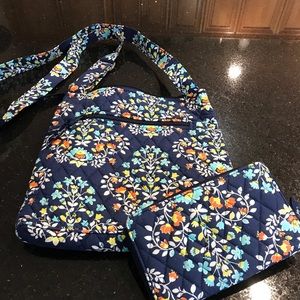A Vera Bradley cross body bag with matching wallet